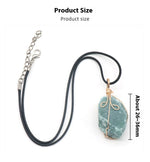 Raw green stone pendant wrapped in gold-tone wire, on black cord — VoxArcana